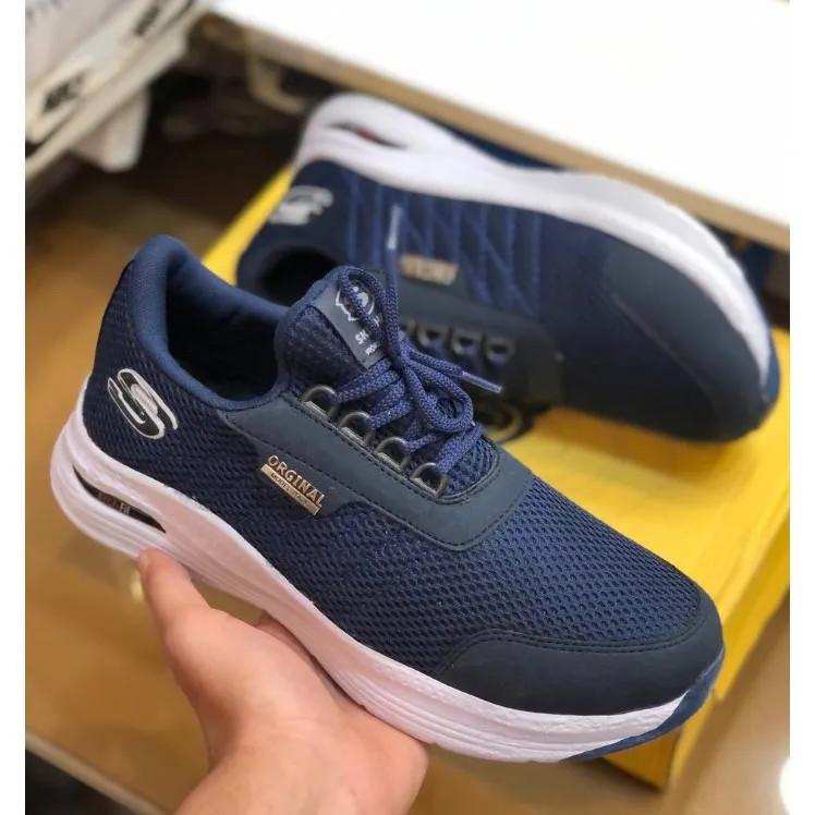 کفش اسکیچرز مردانه مدل بی بند رنگ سورمه ای رویه پارچه ای تنفسی زیره ایربولینگ سبک و راحت پیاده روی
